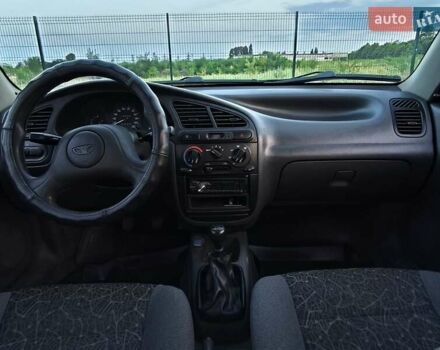 Черный Дэу Ланос, объемом двигателя 1.4 л и пробегом 120 тыс. км за 3100 $, фото 8 на Automoto.ua