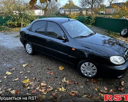 Черный Дэу Ланос, объемом двигателя 1.4 л и пробегом 220 тыс. км за 1800 $, фото 2 на Automoto.ua