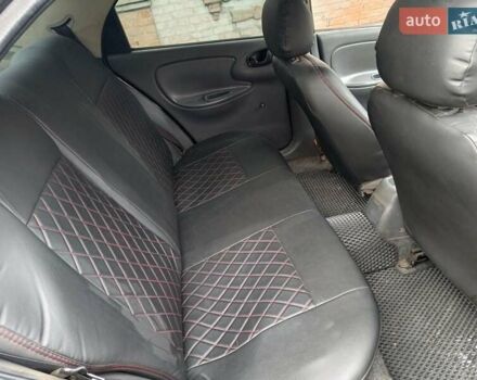 Черный Дэу Ланос, объемом двигателя 1.5 л и пробегом 200 тыс. км за 2100 $, фото 7 на Automoto.ua