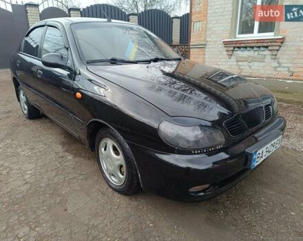 Черный Дэу Ланос, объемом двигателя 1.5 л и пробегом 200 тыс. км за 2100 $, фото 1 на Automoto.ua