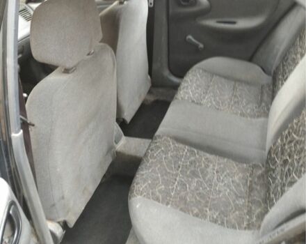 Черный Дэу Ланос, объемом двигателя 1.4 л и пробегом 1 тыс. км за 2000 $, фото 6 на Automoto.ua