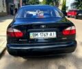 Черный Дэу Ланос, объемом двигателя 1.4 л и пробегом 220 тыс. км за 2400 $, фото 2 на Automoto.ua