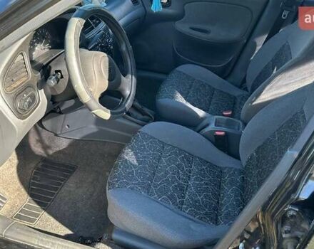 Чорний Деу Ланос, об'ємом двигуна 1.5 л та пробігом 235 тис. км за 2500 $, фото 16 на Automoto.ua