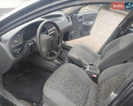 Черный Дэу Ланос, объемом двигателя 1.5 л и пробегом 185 тыс. км за 2100 $, фото 14 на Automoto.ua