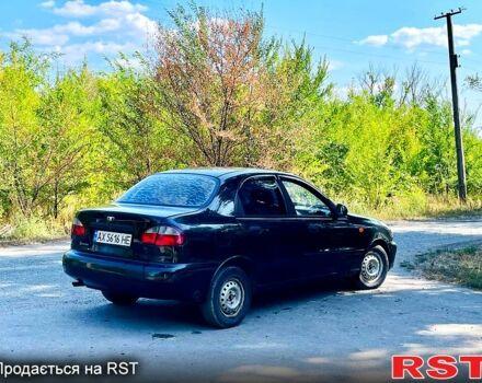 Черный Дэу Ланос, объемом двигателя 1.4 л и пробегом 303 тыс. км за 1199 $, фото 5 на Automoto.ua
