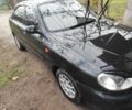 Черный Дэу Ланос, объемом двигателя 1.5 л и пробегом 130 тыс. км за 2700 $, фото 2 на Automoto.ua