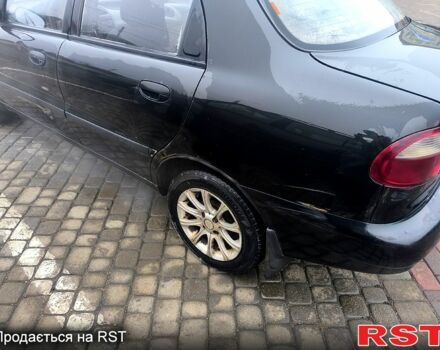 Черный Дэу Ланос, объемом двигателя 1.5 л и пробегом 220 тыс. км за 1000 $, фото 10 на Automoto.ua