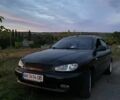 Черный Дэу Ланос, объемом двигателя 1.5 л и пробегом 1000 тыс. км за 2600 $, фото 1 на Automoto.ua