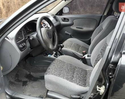 Черный Дэу Ланос, объемом двигателя 1.39 л и пробегом 213 тыс. км за 2300 $, фото 5 на Automoto.ua