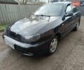 Черный Дэу Ланос, объемом двигателя 1.5 л и пробегом 200 тыс. км за 2100 $, фото 1 на Automoto.ua