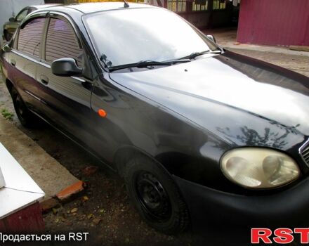 Черный Дэу Ланос, объемом двигателя 1.5 л и пробегом 230 тыс. км за 2000 $, фото 1 на Automoto.ua