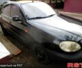 Черный Дэу Ланос, объемом двигателя 1.5 л и пробегом 230 тыс. км за 2000 $, фото 1 на Automoto.ua
