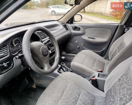 Черный Дэу Ланос, объемом двигателя 1.5 л и пробегом 350 тыс. км за 1800 $, фото 5 на Automoto.ua