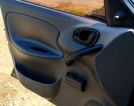 Черный Дэу Ланос, объемом двигателя 1.5 л и пробегом 240 тыс. км за 3300 $, фото 7 на Automoto.ua