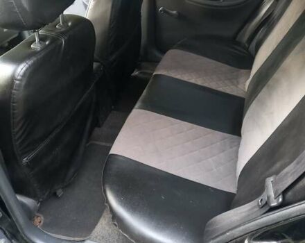 Черный Дэу Ланос, объемом двигателя 1.5 л и пробегом 300 тыс. км за 3200 $, фото 2 на Automoto.ua