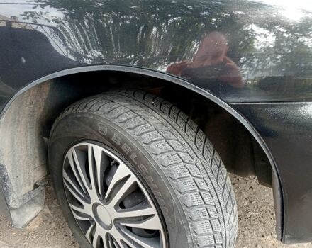 Черный Дэу Ланос, объемом двигателя 1.5 л и пробегом 213 тыс. км за 2400 $, фото 2 на Automoto.ua