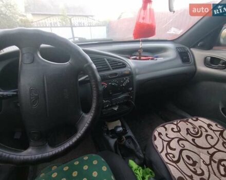 Черный Дэу Ланос, объемом двигателя 1.6 л и пробегом 262 тыс. км за 1850 $, фото 3 на Automoto.ua