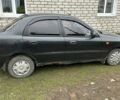Черный Дэу Ланос, объемом двигателя 1.5 л и пробегом 179 тыс. км за 2200 $, фото 1 на Automoto.ua