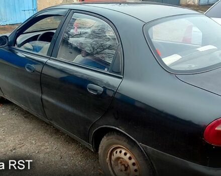 Черный Дэу Ланос, объемом двигателя 1.4 л и пробегом 222 тыс. км за 1400 $, фото 1 на Automoto.ua