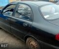 Черный Дэу Ланос, объемом двигателя 1.4 л и пробегом 222 тыс. км за 1400 $, фото 1 на Automoto.ua