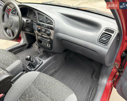 Черный Дэу Ланос, объемом двигателя 1.6 л и пробегом 156 тыс. км за 2400 $, фото 7 на Automoto.ua