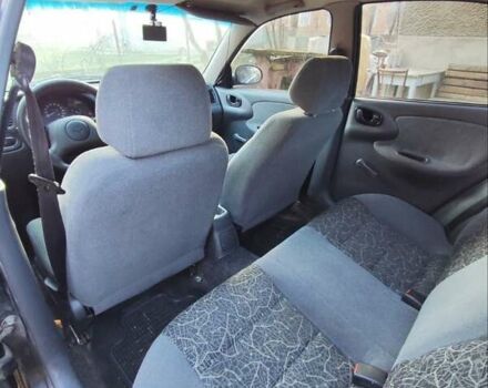 Черный Дэу Ланос, объемом двигателя 1.4 л и пробегом 165 тыс. км за 1450 $, фото 8 на Automoto.ua