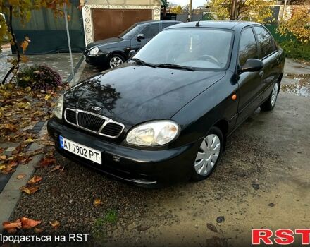 Черный Дэу Ланос, объемом двигателя 1.4 л и пробегом 220 тыс. км за 1800 $, фото 9 на Automoto.ua