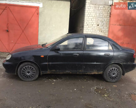 Черный Дэу Ланос, объемом двигателя 1.5 л и пробегом 150 тыс. км за 950 $, фото 1 на Automoto.ua