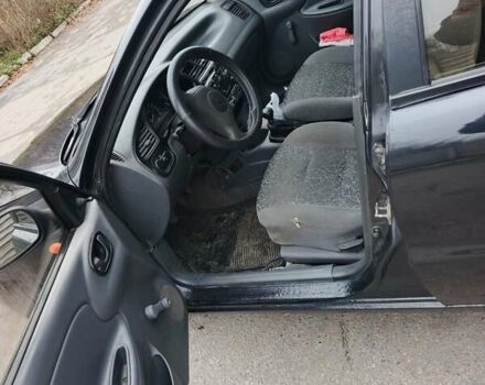 Черный Дэу Ланос, объемом двигателя 1.5 л и пробегом 240 тыс. км за 1800 $, фото 1 на Automoto.ua