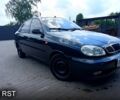 Черный Дэу Ланос, объемом двигателя 1.6 л и пробегом 300 тыс. км за 2800 $, фото 1 на Automoto.ua