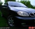 Черный Дэу Ланос, объемом двигателя 1.5 л и пробегом 197 тыс. км за 2550 $, фото 1 на Automoto.ua