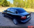 Черный Дэу Ланос, объемом двигателя 1.6 л и пробегом 160 тыс. км за 2700 $, фото 1 на Automoto.ua