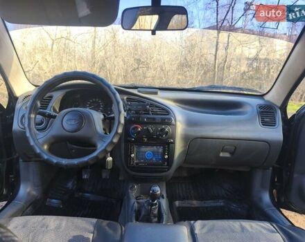 Черный Дэу Ланос, объемом двигателя 1.5 л и пробегом 216 тыс. км за 2699 $, фото 4 на Automoto.ua