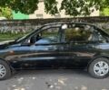 Черный Дэу Ланос, объемом двигателя 1.5 л и пробегом 210 тыс. км за 2600 $, фото 1 на Automoto.ua