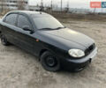 Черный Дэу Ланос, объемом двигателя 1.5 л и пробегом 219 тыс. км за 2300 $, фото 1 на Automoto.ua