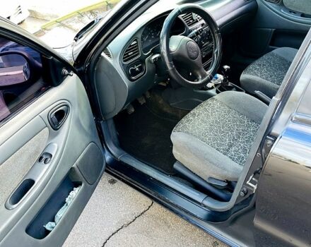 Черный Дэу Ланос, объемом двигателя 1.6 л и пробегом 326 тыс. км за 2700 $, фото 4 на Automoto.ua