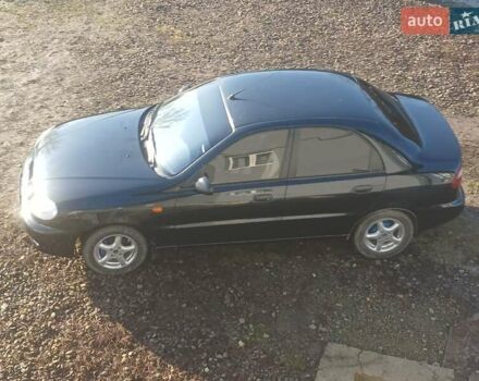 Черный Дэу Ланос, объемом двигателя 1.5 л и пробегом 76 тыс. км за 2300 $, фото 1 на Automoto.ua