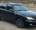 Черный Дэу Ланос, объемом двигателя 1.5 л и пробегом 167 тыс. км за 2600 $, фото 1 на Automoto.ua