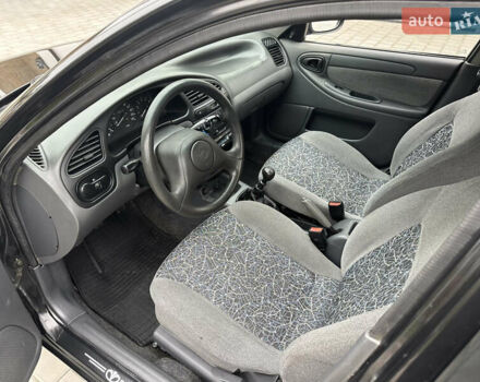 Черный Дэу Ланос, объемом двигателя 1.5 л и пробегом 158 тыс. км за 2850 $, фото 27 на Automoto.ua