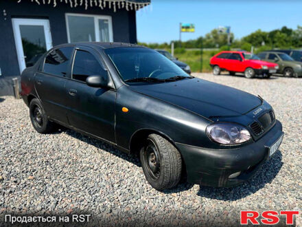 Черный Дэу Ланос, объемом двигателя 1.5 л и пробегом 400 тыс. км за 1100 $, фото 1 на Automoto.ua