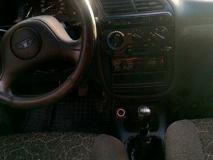 Черный Дэу Ланос, объемом двигателя 1.5 л и пробегом 230 тыс. км за 1000 $, фото 1 на Automoto.ua