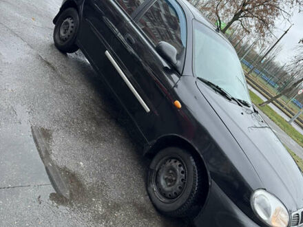 Черный Дэу Ланос, объемом двигателя 1.5 л и пробегом 350 тыс. км за 2450 $, фото 1 на Automoto.ua