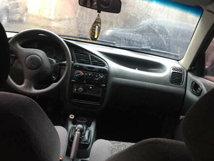 Чорний Деу Ланос, об'ємом двигуна 1.39 л та пробігом 200 тис. км за 900 $, фото 1 на Automoto.ua