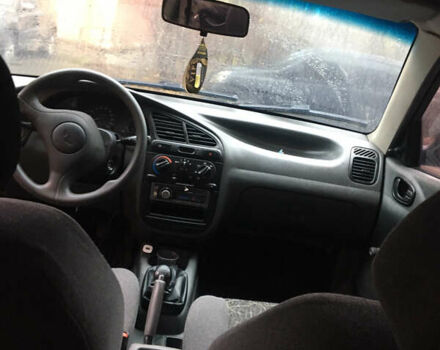 Чорний Деу Ланос, об'ємом двигуна 1.39 л та пробігом 200 тис. км за 900 $, фото 1 на Automoto.ua