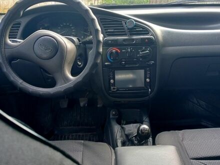 Черный Дэу Ланос, объемом двигателя 1.5 л и пробегом 213 тыс. км за 2400 $, фото 1 на Automoto.ua