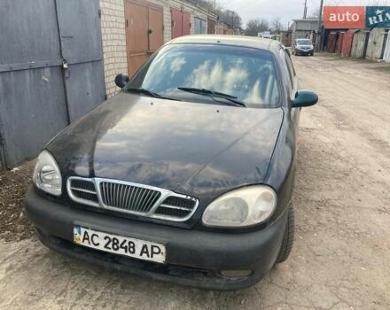 Чорний Деу Ланос, об'ємом двигуна 1.5 л та пробігом 200 тис. км за 590 $, фото 1 на Automoto.ua