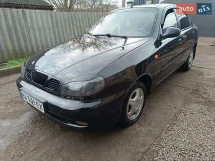 Черный Дэу Ланос, объемом двигателя 1.5 л и пробегом 200 тыс. км за 2100 $, фото 1 на Automoto.ua