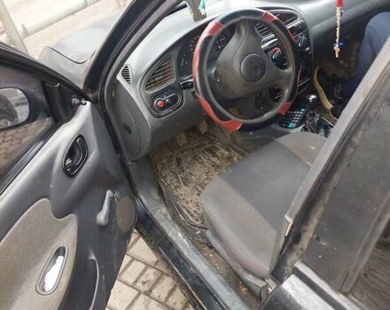 Чорний Деу Ланос, об'ємом двигуна 1.39 л та пробігом 320 тис. км за 1500 $, фото 1 на Automoto.ua