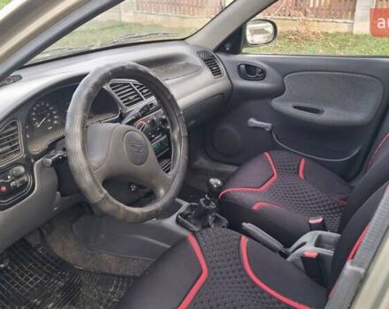 Коричневый Дэу Ланос, объемом двигателя 1.4 л и пробегом 150 тыс. км за 1750 $, фото 3 на Automoto.ua