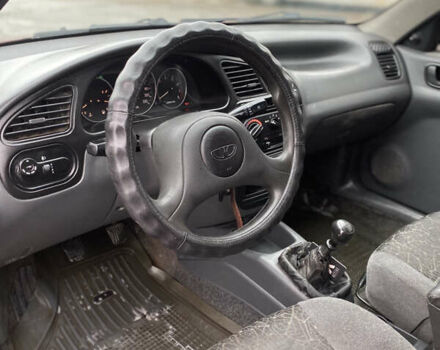 Красный Дэу Ланос, объемом двигателя 1.5 л и пробегом 350 тыс. км за 1399 $, фото 5 на Automoto.ua